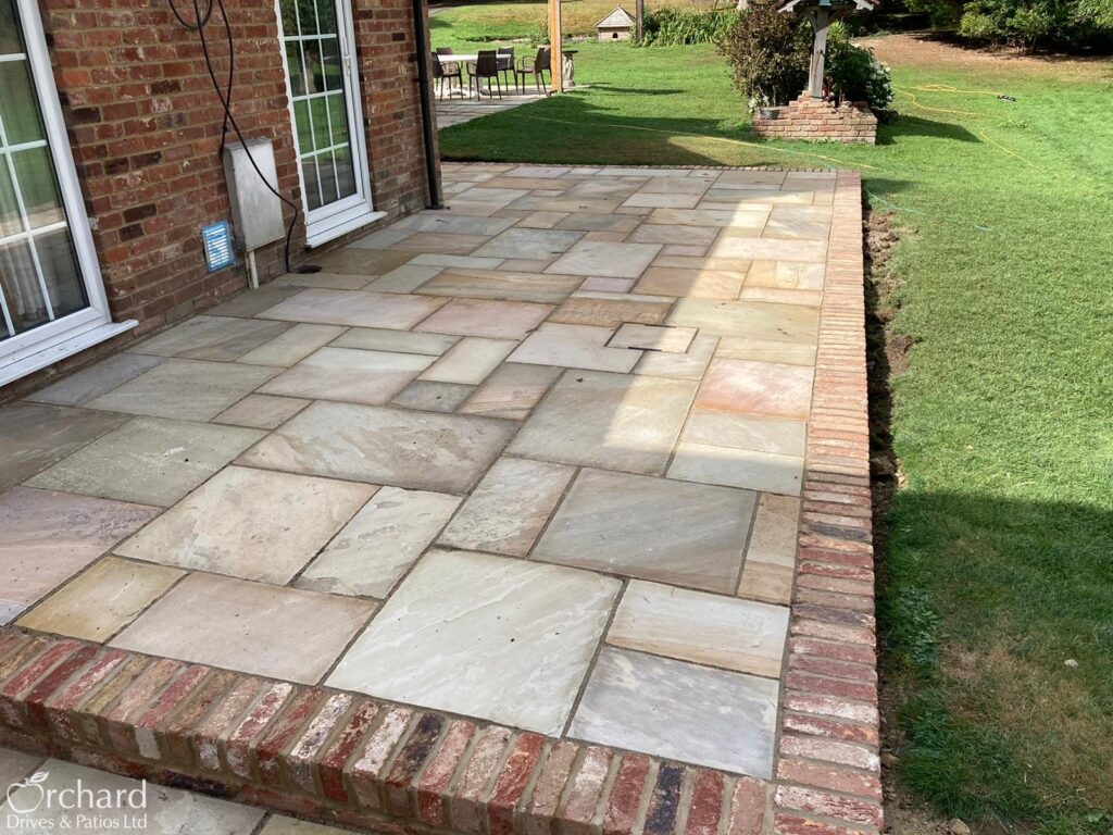 Orchard Drives and Patios - Fossil Sandstone Patio with Country Style Brick Edging - Benenden, Kent